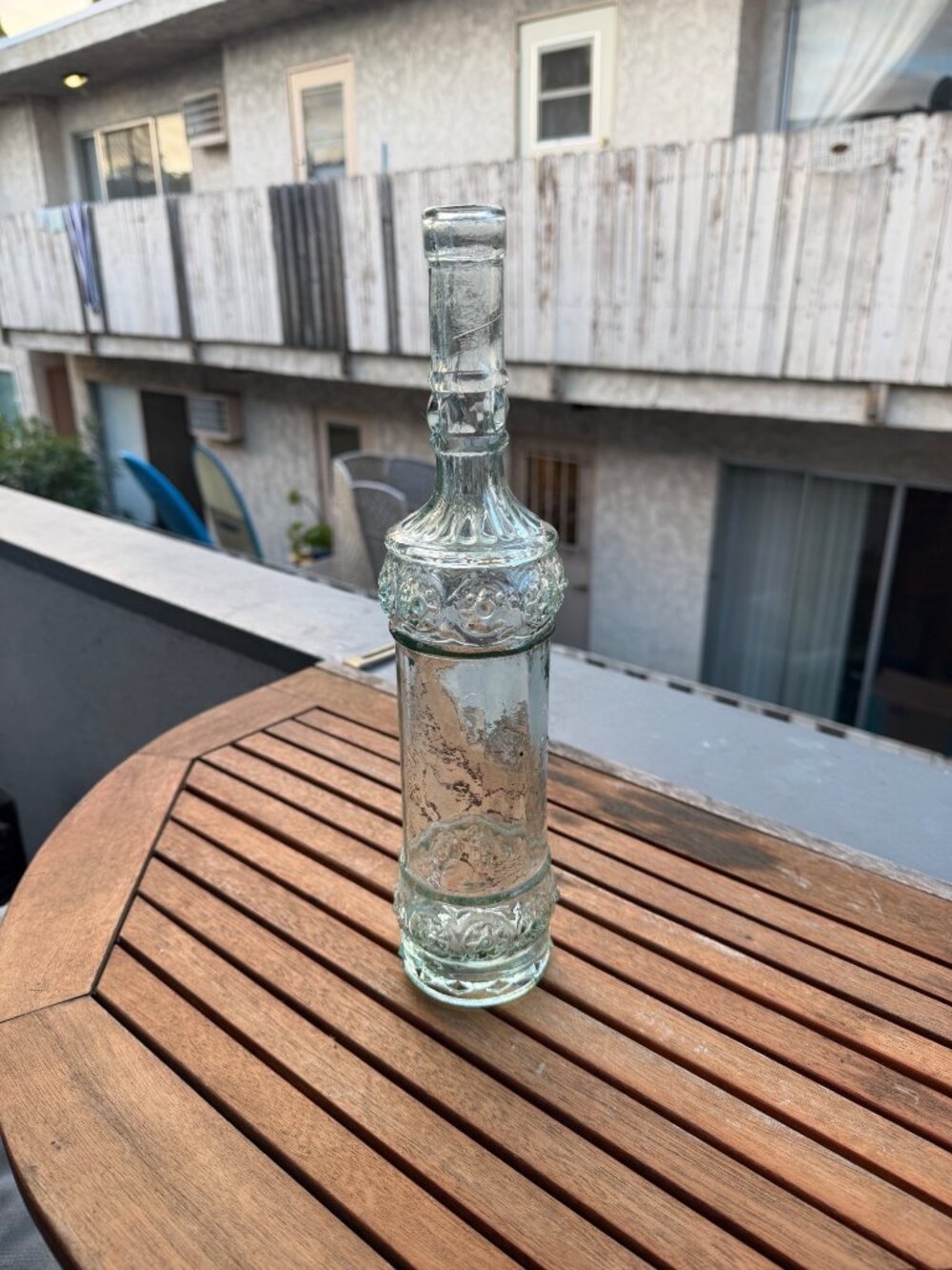 Vintage Clear Glass Decorative Bottle With Ornate Floral Design